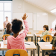 Black Kid raising hand
